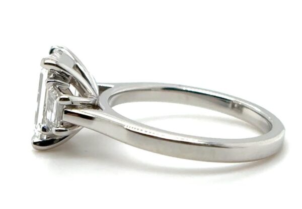 Three Stone Emerald Cut Ring with Step-Cut Trapezoid Side Diamonds - Image 3